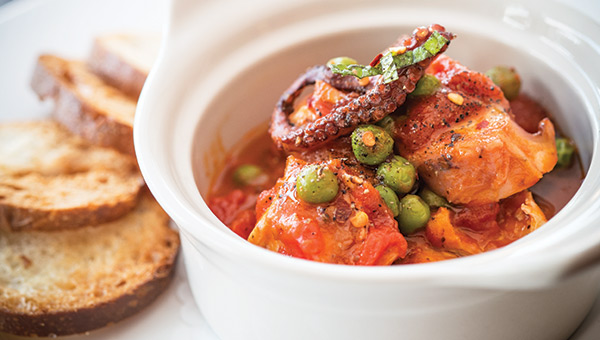 Polpo alla romana, with octopus, sweet peas, tomatoes and fresh mint. (Photo by Steve Legato)
