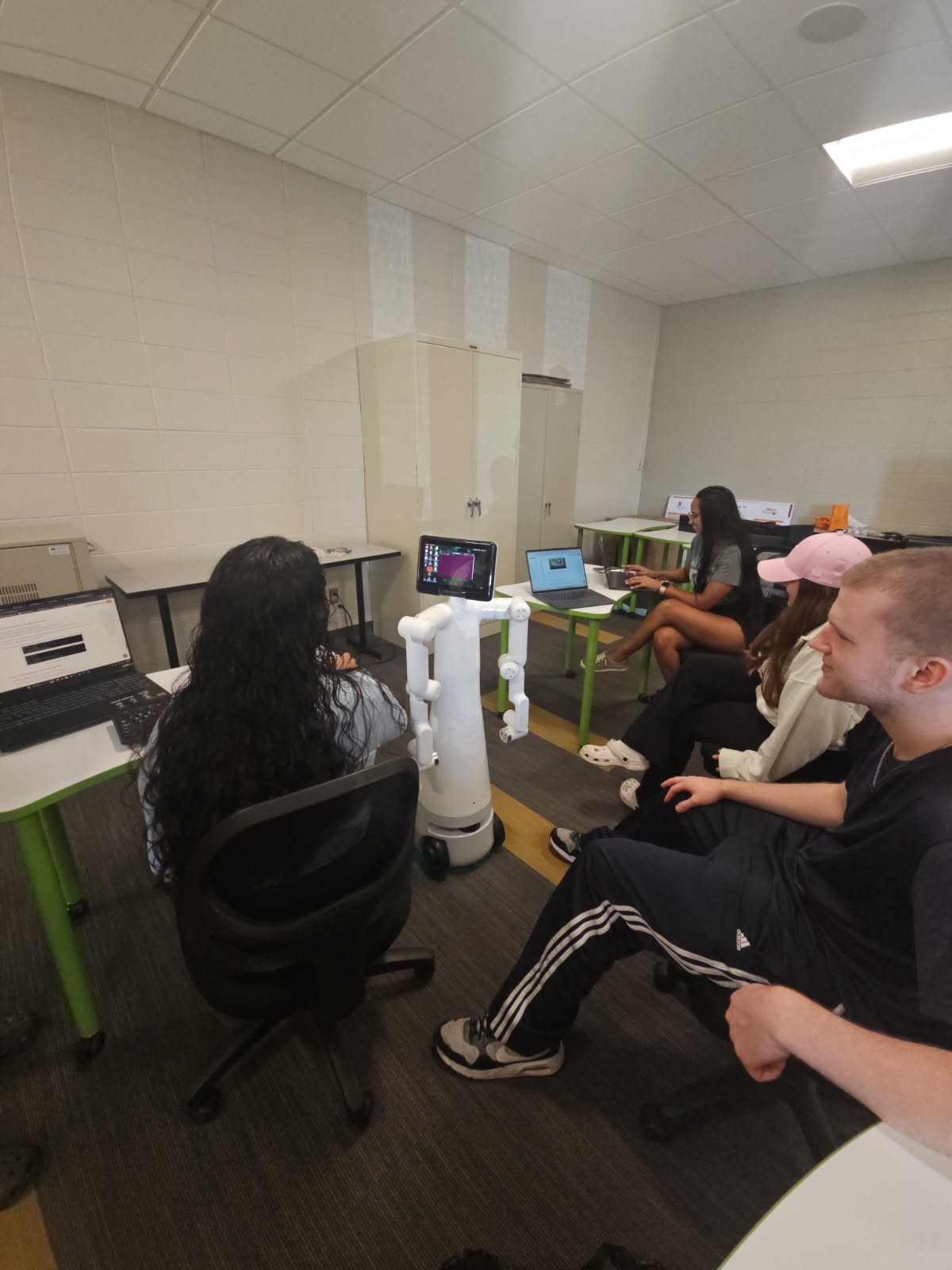 Students working with the Elephant Robotics Mercury Humanoid at Gwynedd Mercy University